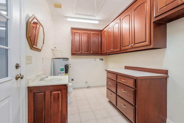 laundry area with water heater, hookup for a washing machine, light tile patterned flooring, hookup for an electric dryer, and sink