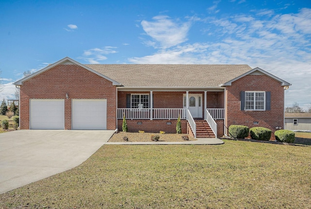 ranch-style house featuring a garage, covered porch, and a front yard