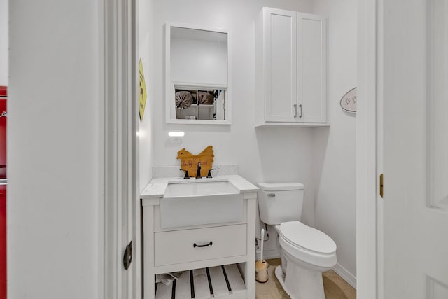 bathroom with toilet and vanity