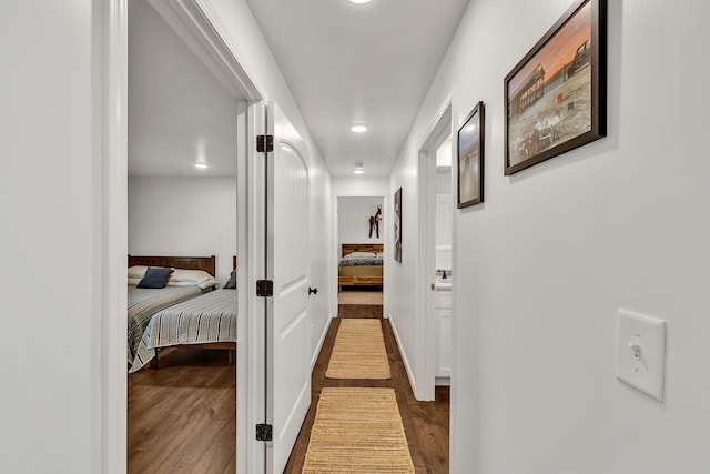 hallway featuring dark hardwood / wood-style flooring