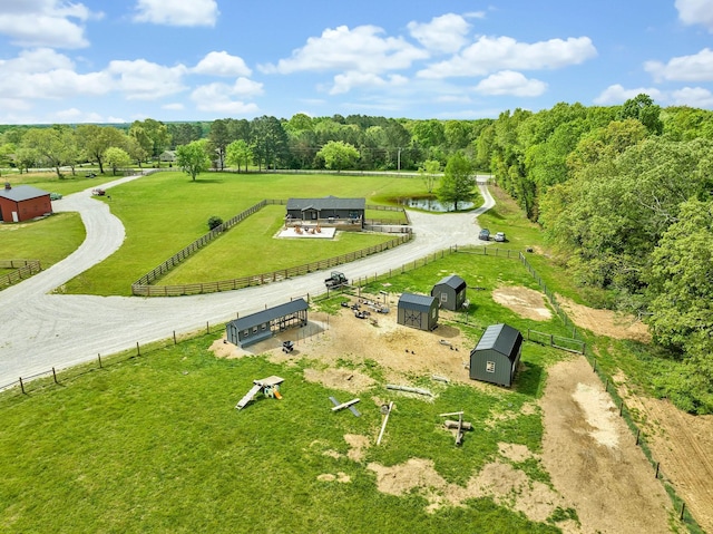 birds eye view of property with a rural view