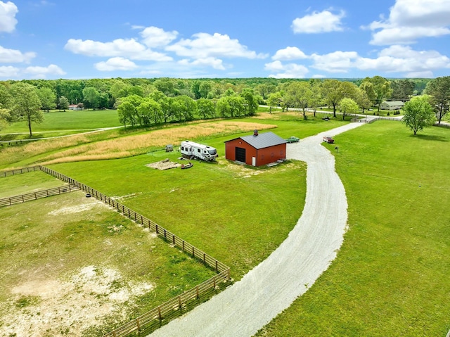 birds eye view of property with a rural view