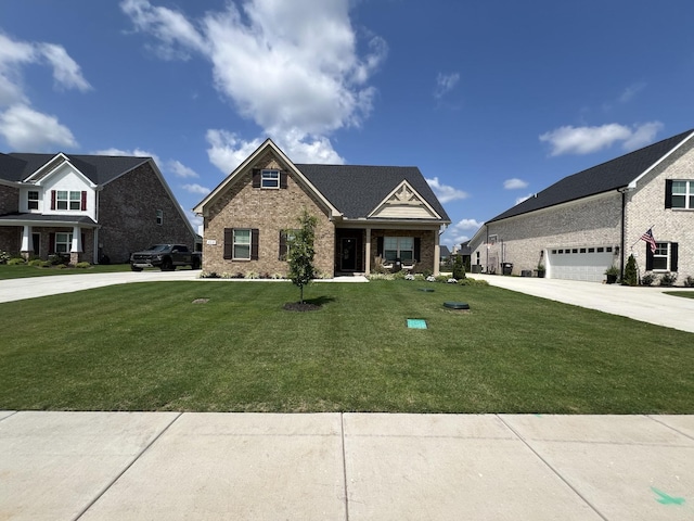 view of front of property with a garage and a front yard