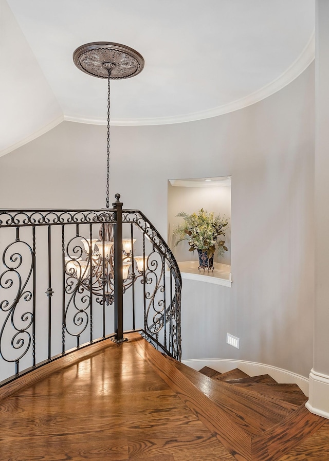 stairway featuring crown molding