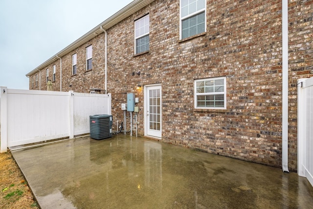 exterior space featuring central AC unit and a patio