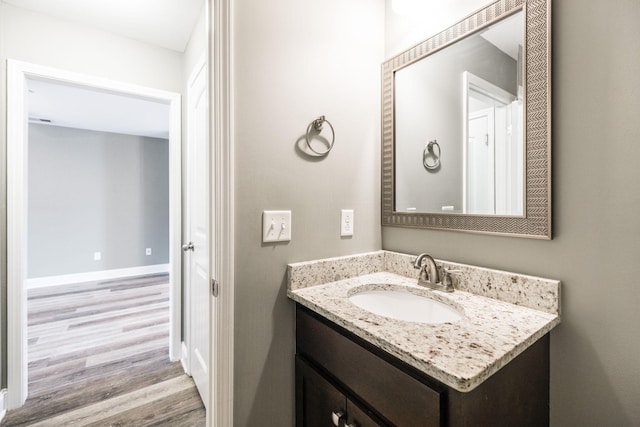 bathroom featuring vanity and hardwood / wood-style floors