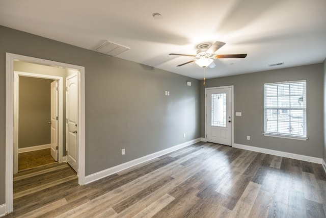 foyer entrance with ceiling fan and dark hardwood / wood-style floors