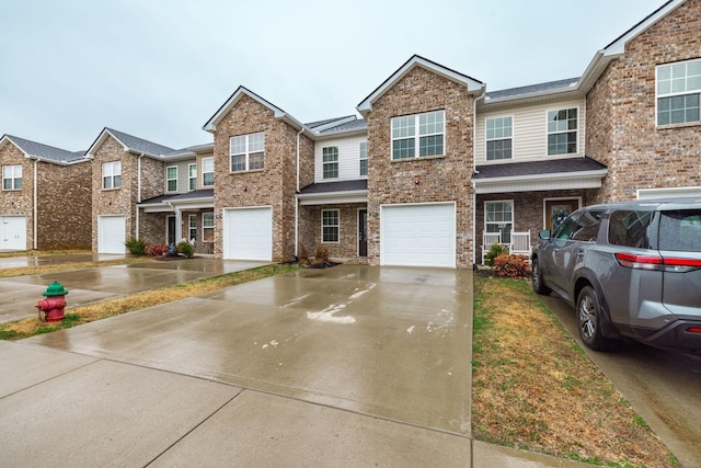 multi unit property featuring a garage