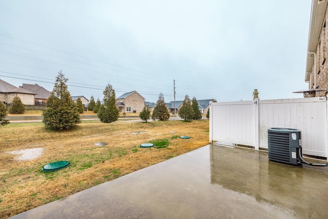 view of yard with a patio area and central AC