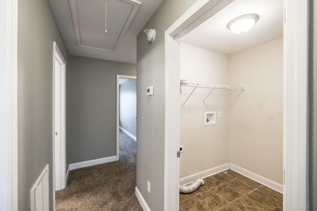 laundry area featuring dark colored carpet and washer hookup