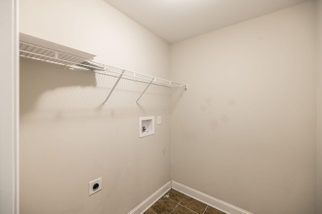 laundry area with washer hookup, dark tile patterned flooring, and electric dryer hookup