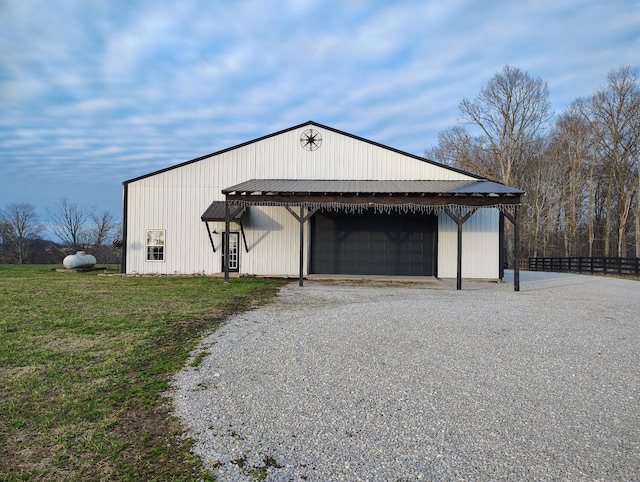 garage featuring a lawn