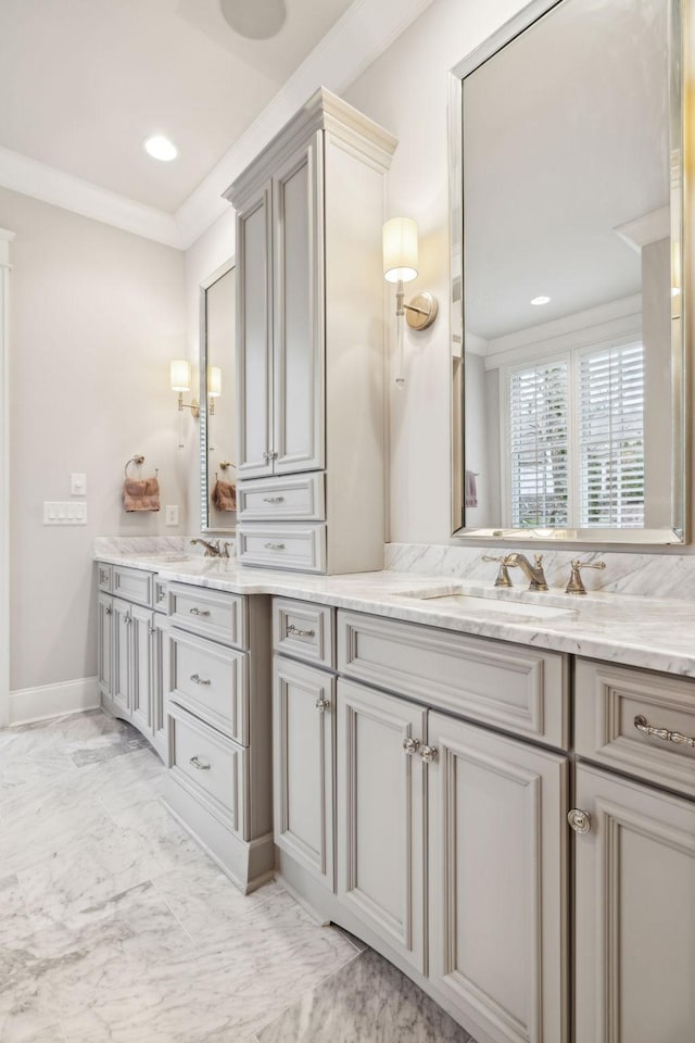 full bathroom featuring recessed lighting, vanity, baseboards, marble finish floor, and crown molding