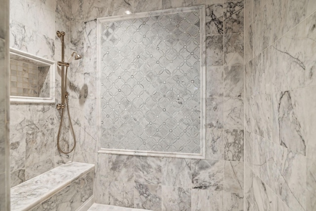 full bath with a tile shower