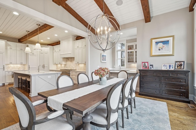 dining space with a chandelier, light wood-style flooring, and recessed lighting