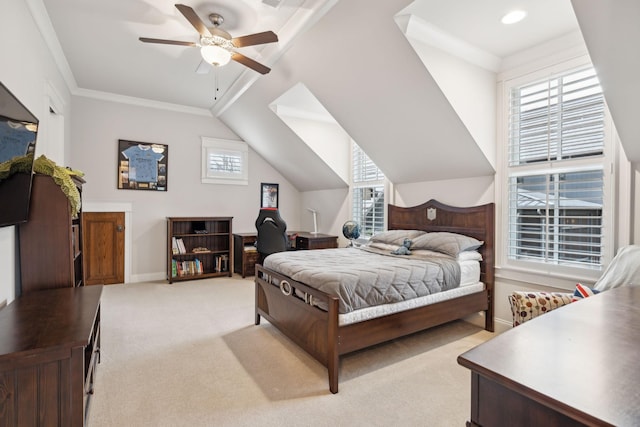 bedroom with baseboards, light colored carpet, ceiling fan, vaulted ceiling, and crown molding