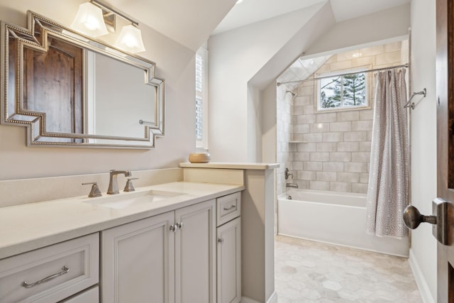 bathroom featuring shower / bath combo with shower curtain and vanity