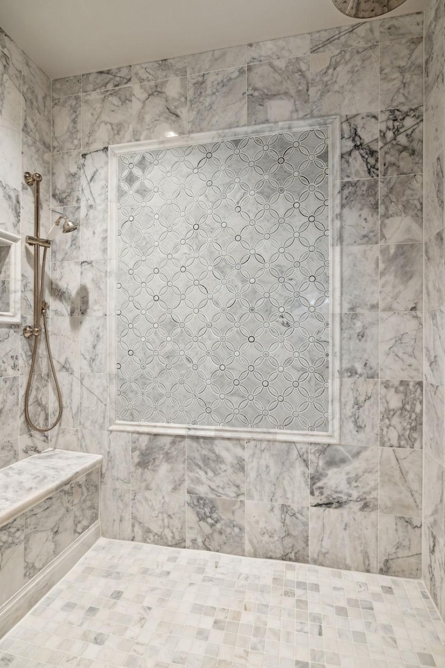 bathroom featuring tiled shower