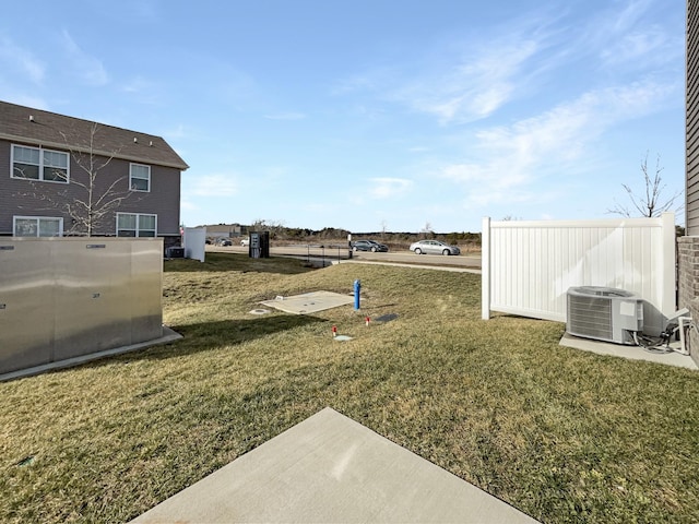 view of yard with central AC