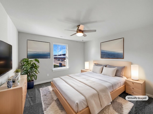 bedroom with dark colored carpet, visible vents, ceiling fan, and baseboards