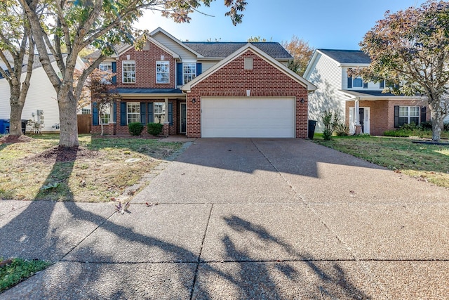 view of front of home with a garage and a front lawn