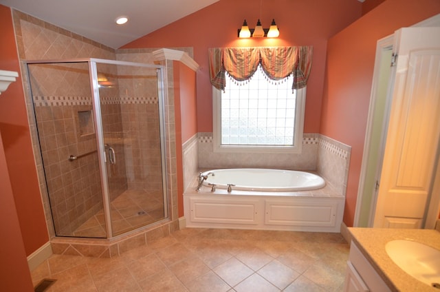 bathroom with separate shower and tub, tile patterned flooring, vanity, and lofted ceiling