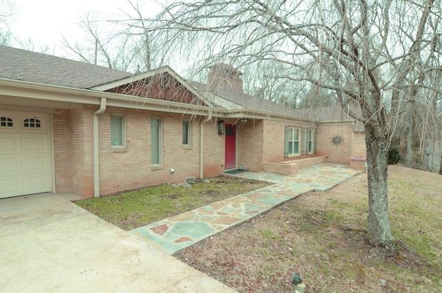 single story home featuring a garage