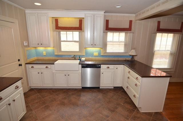 kitchen featuring sink, kitchen peninsula, white cabinets, and dishwasher