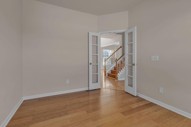 9746 Northfork Dr, Brentwood, TN 37027 - unfurnished room featuring light wood-style floors, baseboards, and french doors
