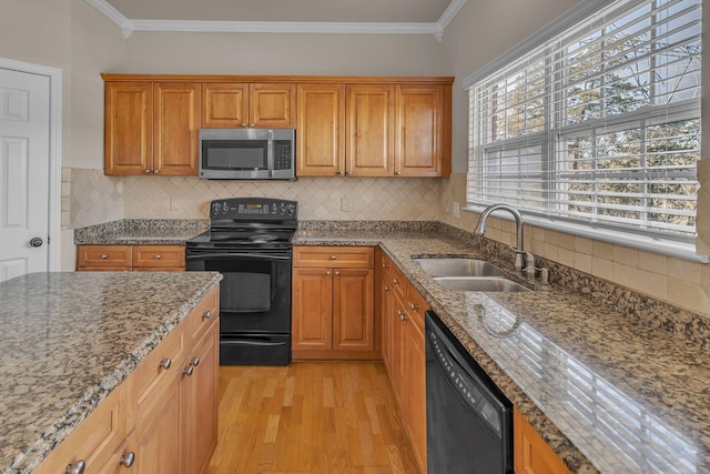 9746 Northfork Dr, Brentwood, TN 37027 - kitchen with ornamental molding, a sink, light wood finished floors, and black appliances