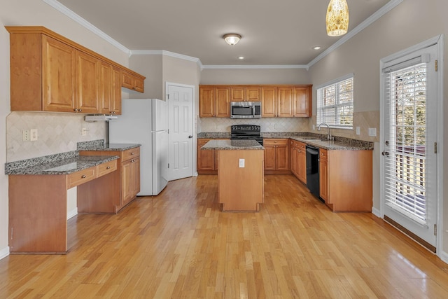 9746 Northfork Dr, Brentwood, TN 37027 - kitchen featuring black appliances, dark stone countertops, a kitchen island, and light wood-style flooring