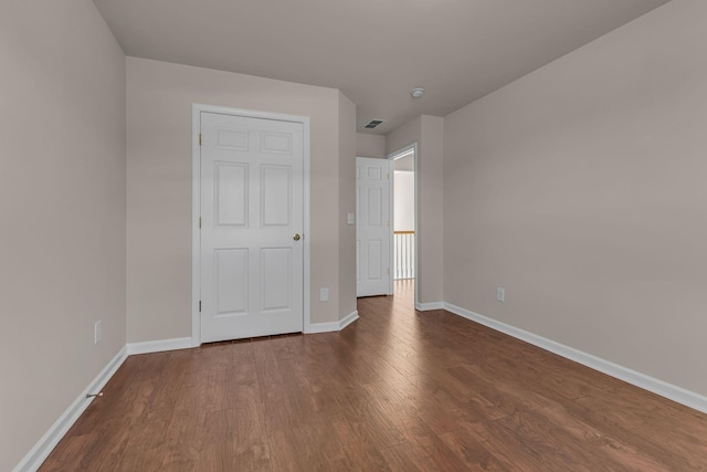 9746 Northfork Dr, Brentwood, TN 37027 - unfurnished bedroom with visible vents, baseboards, and dark wood-type flooring