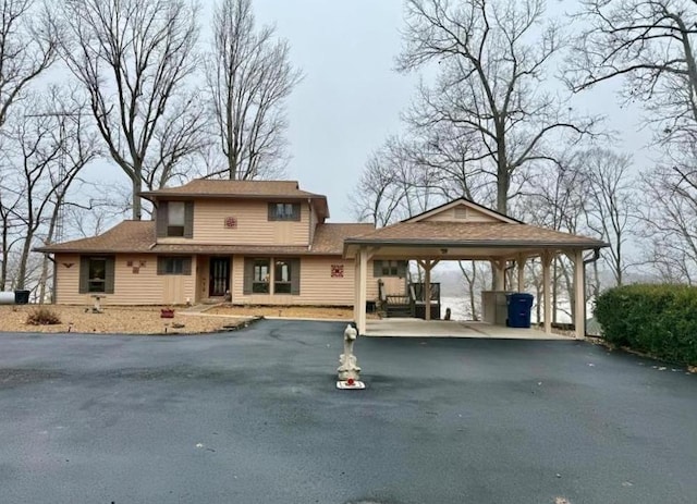 view of front of home with a carport