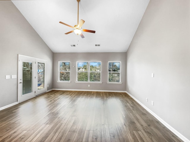 interior space featuring ceiling fan, high vaulted ceiling, and dark hardwood / wood-style flooring