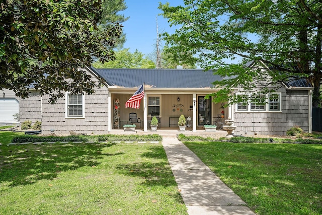 single story home with a porch and a front lawn