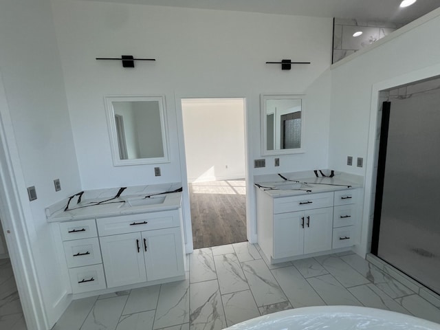 bathroom with vanity and a towering ceiling