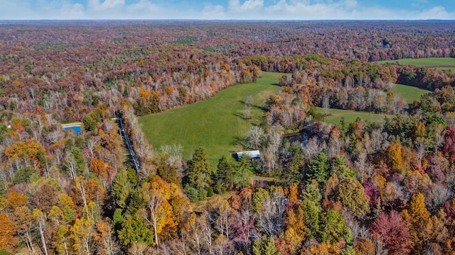 birds eye view of property with a wooded view