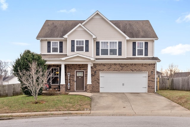 view of front of home with a front yard and a garage