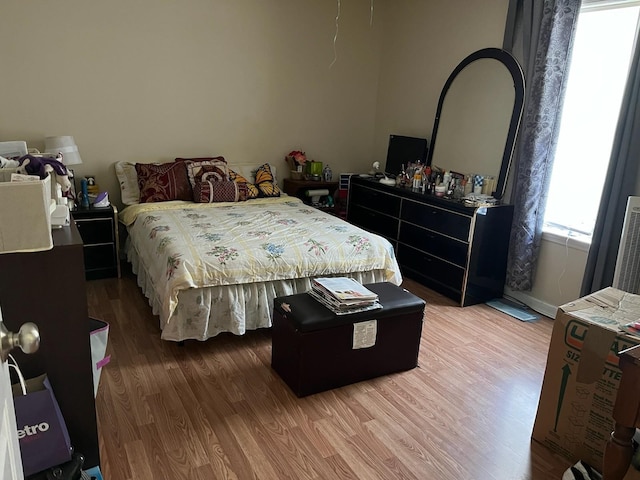 bedroom with wood-type flooring