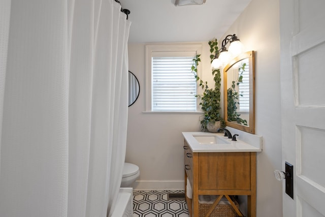 bathroom with vanity, a shower with curtain, and toilet