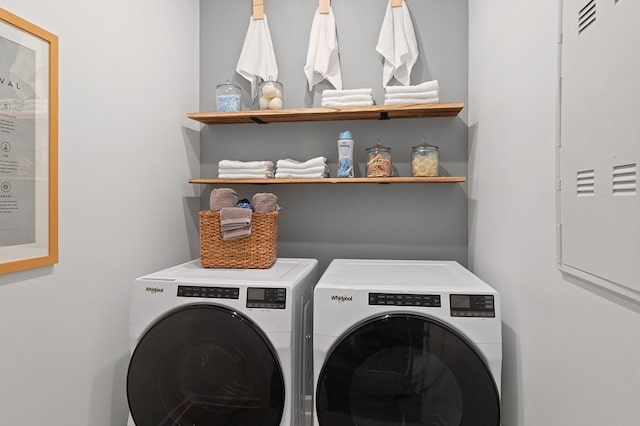 washroom featuring washing machine and dryer and laundry area