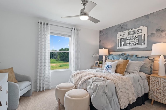 bedroom with carpet, a ceiling fan, and baseboards