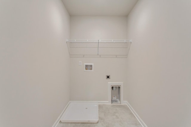 clothes washing area featuring light carpet, laundry area, baseboards, hookup for an electric dryer, and washer hookup