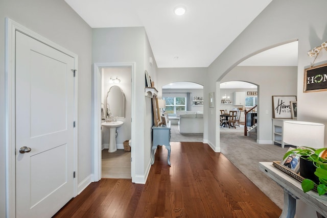 corridor featuring dark hardwood / wood-style floors