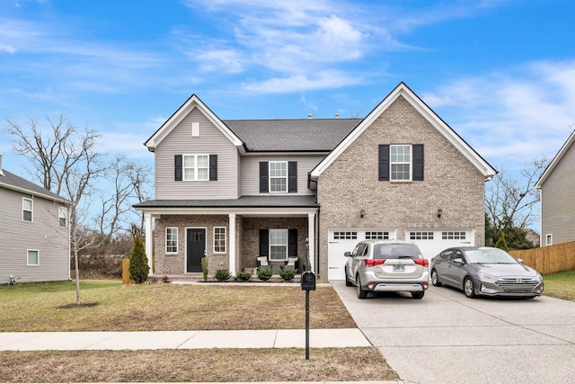 view of front property with a garage, a porch, and a front yard