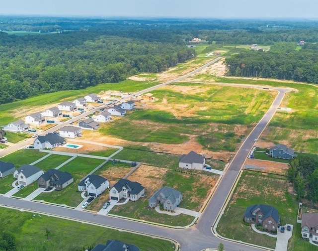 aerial view featuring a residential view and a view of trees