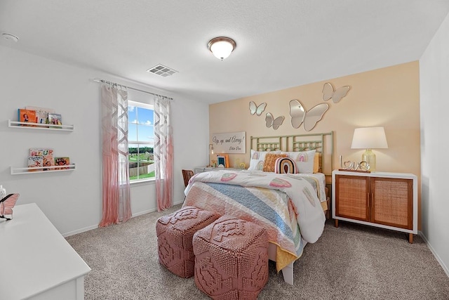 carpeted bedroom featuring baseboards and visible vents