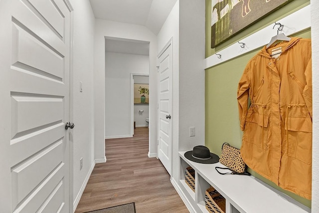 mudroom featuring wood finished floors and baseboards