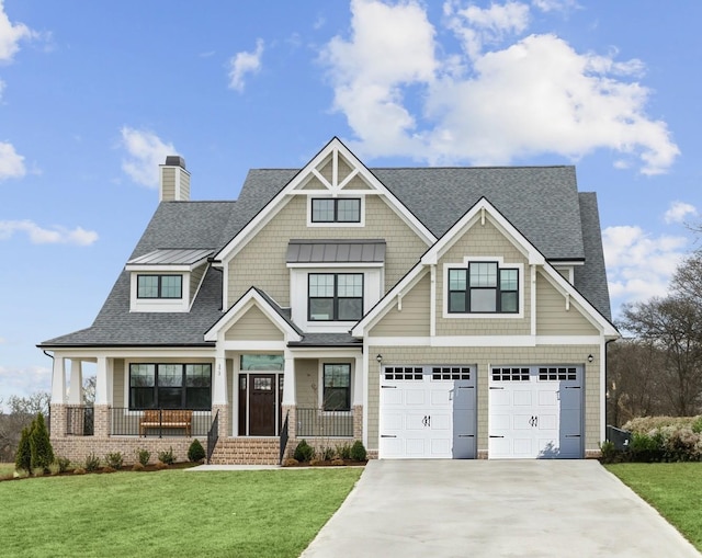 craftsman-style house featuring a front yard, a garage, and a porch