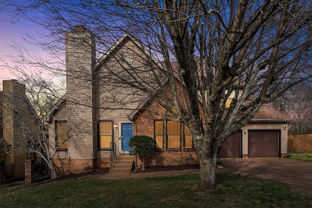 view of front facade featuring driveway, a chimney, roof with shingles, crawl space, and a front yard